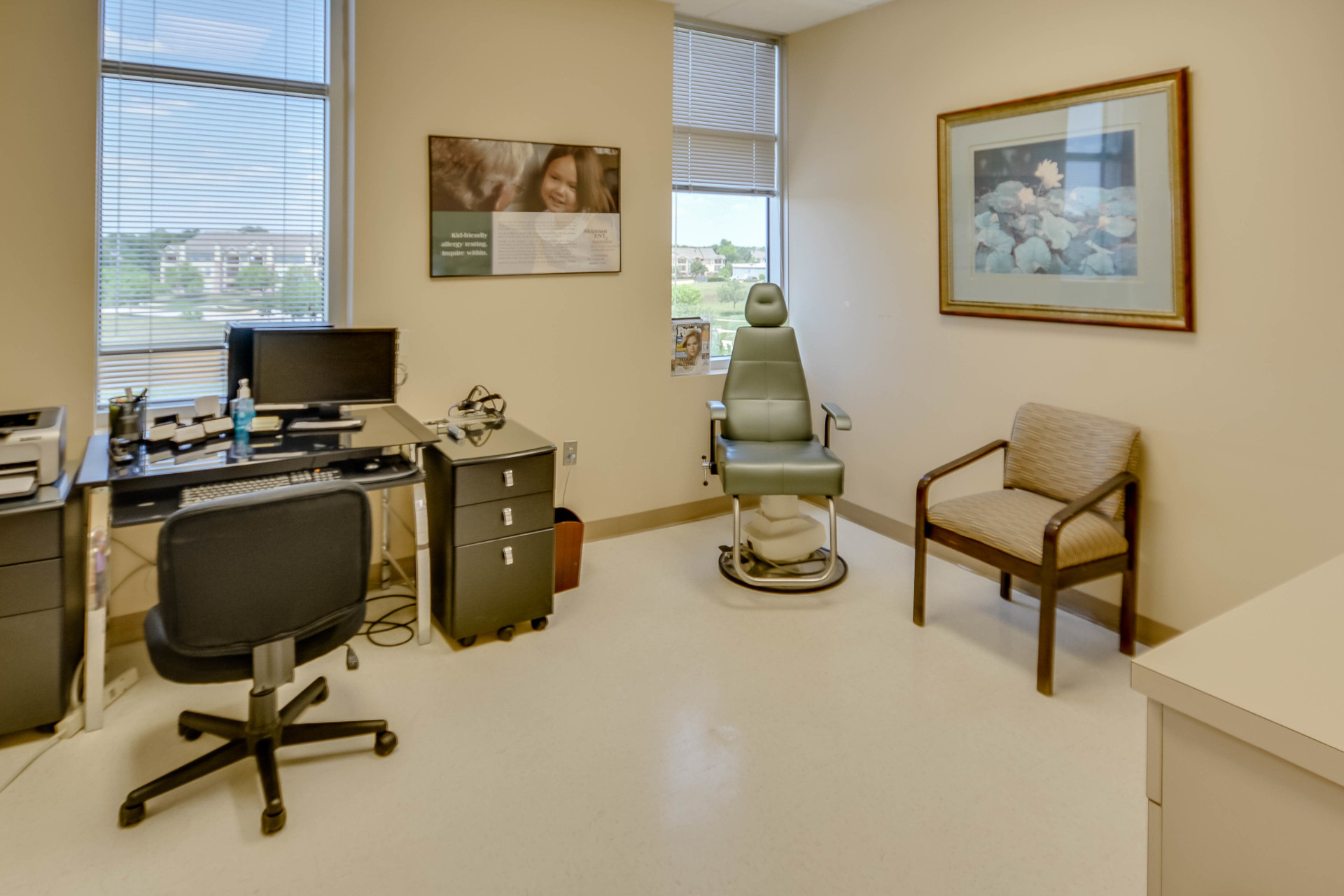 Exam room with patient chair in corner at Audible Hearing Centers
